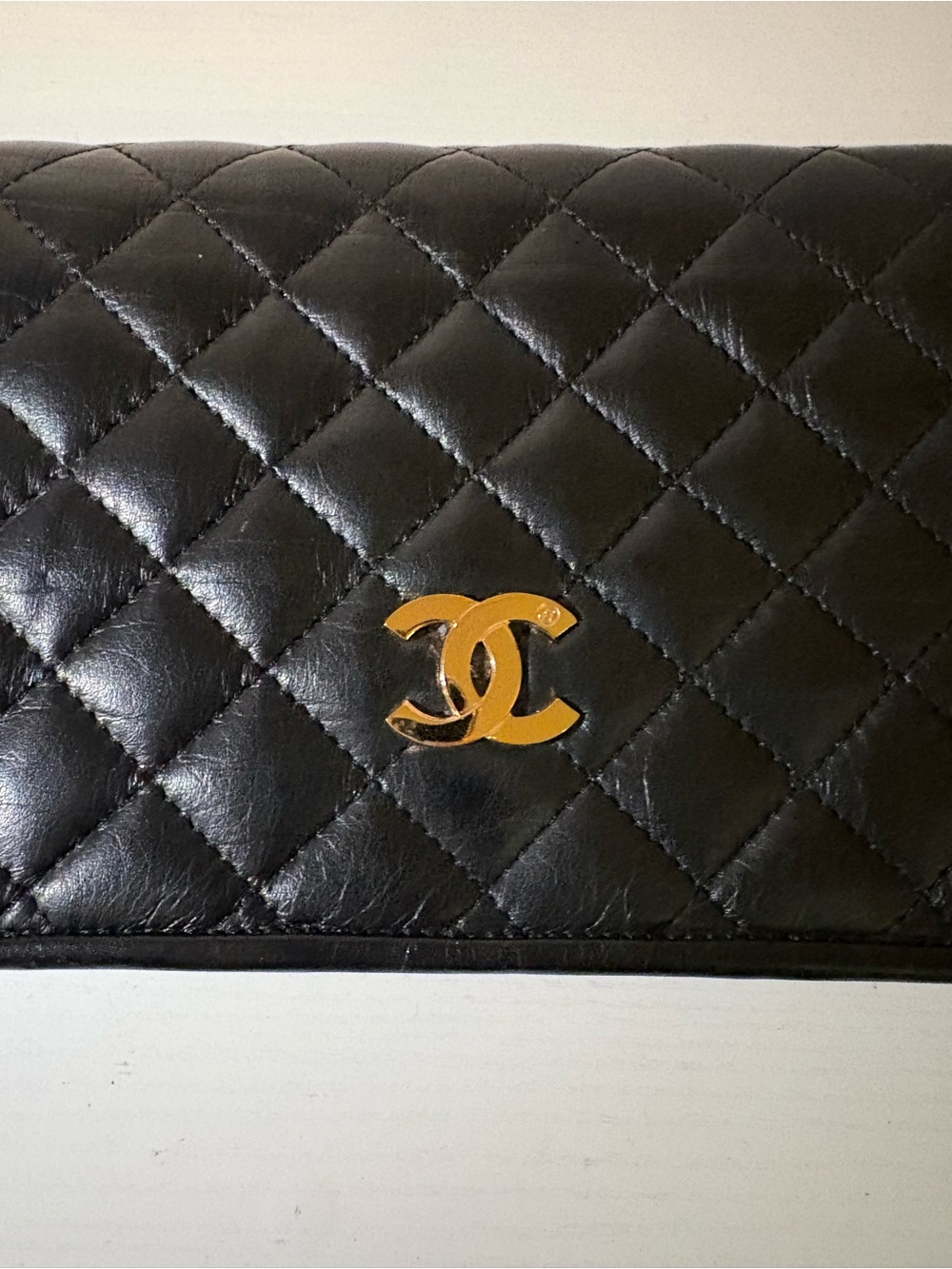CHANEL Black Quilted Leather Wallet with Gold CC Emblem